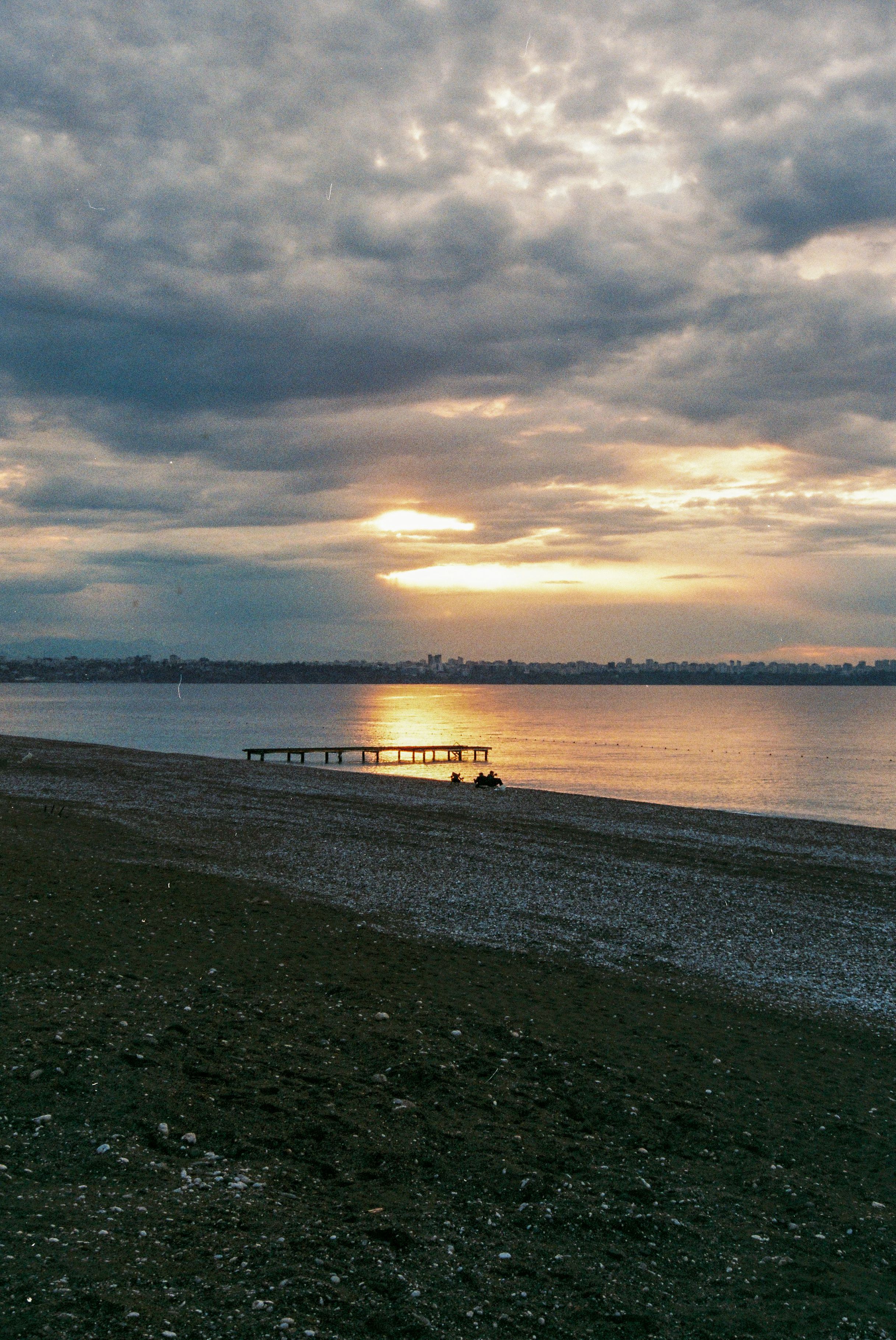 Sunset Behind Cloudy Sky over Lake · Free Stock Photo