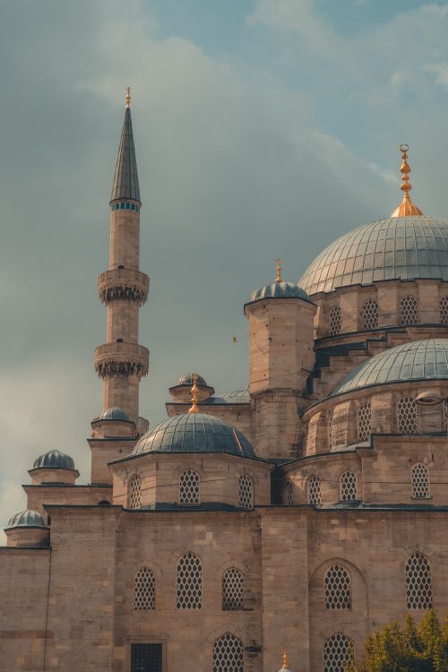 Free Beautiful exterior of an Ottoman mosque in Istanbul, showcasing its domes and minaret. Stock Photo