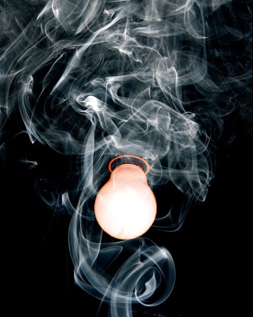 Close-Up Photo of Light Bulb With Smoke