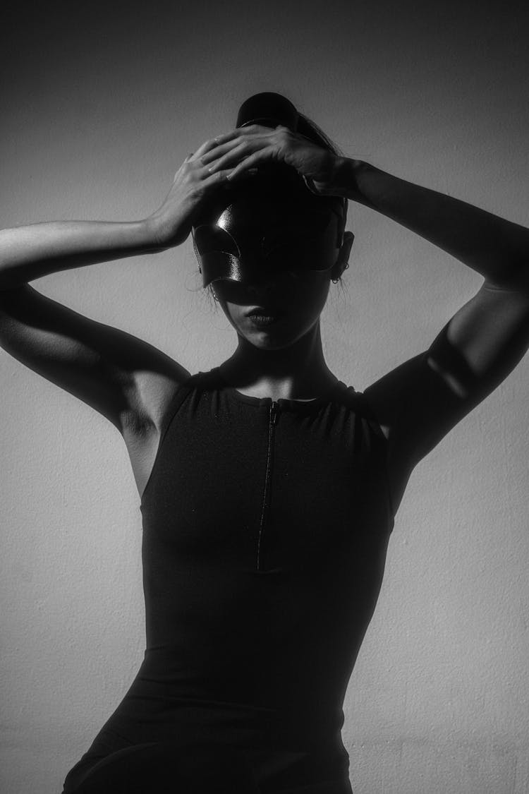 Woman In Mask Posing In Studio