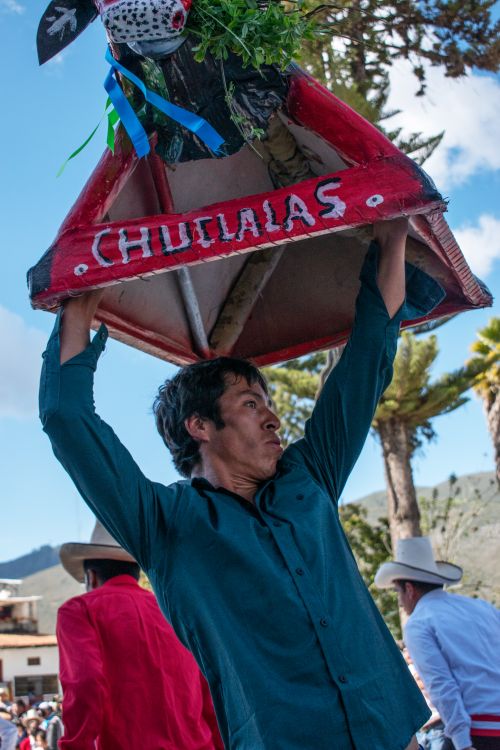 Free A man lifts a traditional festival ornament during an event in Celendín, Cajamarca, Peru. Stock Photo