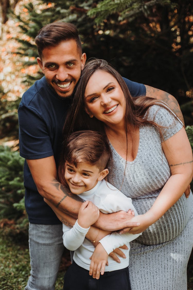 Serene Family Standing In Park