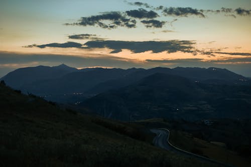 Road through the Mountain Range at Sunset