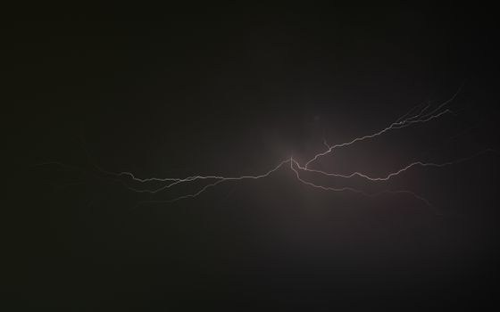 A stunning display of lightning cutting through a dark night sky, capturing the raw power of nature.