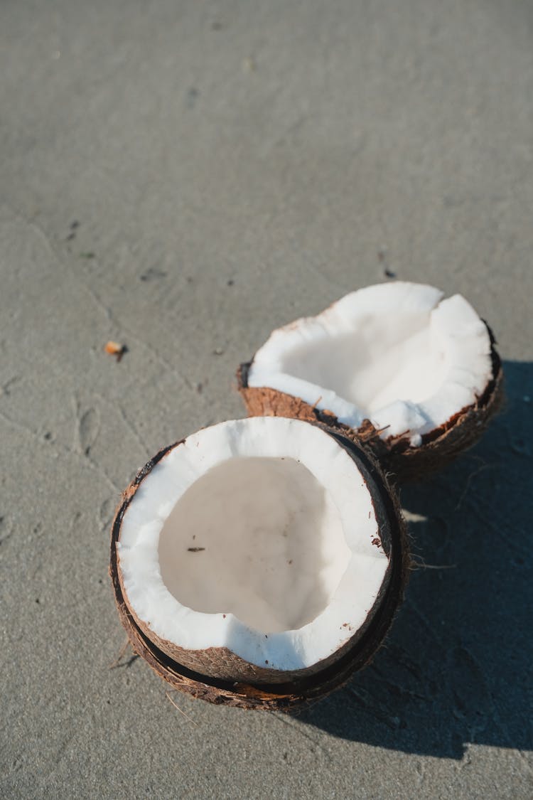 Cut In Half Coconut On Beach