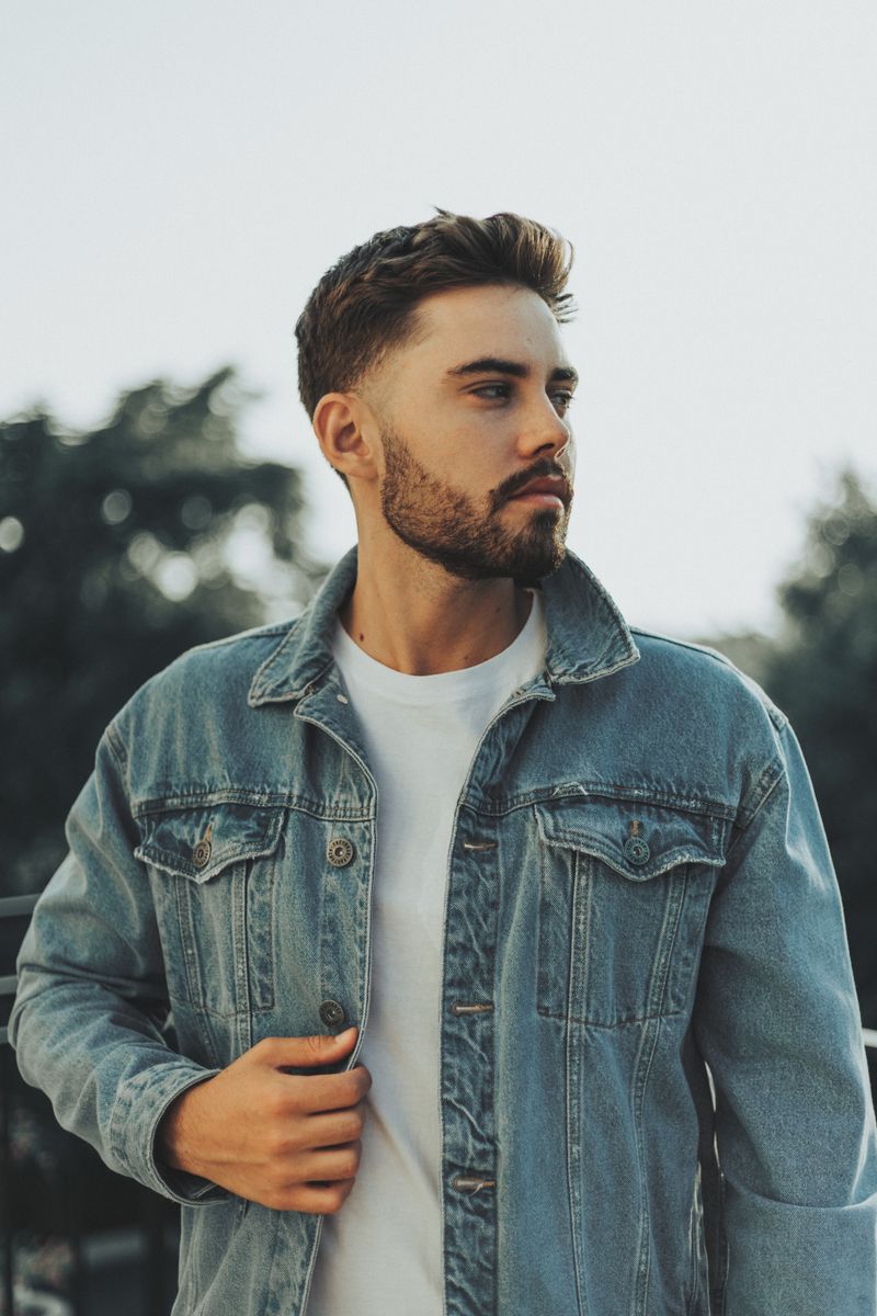 A Man in Denim Jacket Looking Sideway · Free Stock Photo
