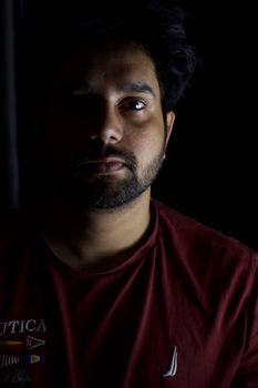 Portrait of a man with dramatic side lighting, creating a mysterious and introspective mood.. portrait, with, dramatic