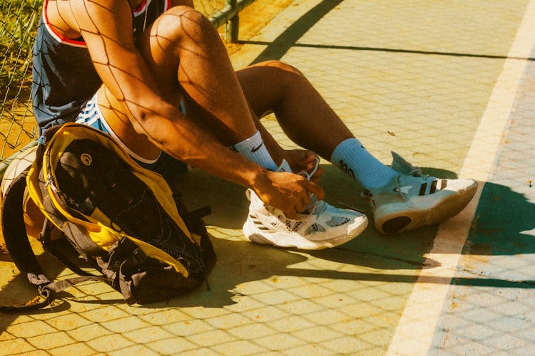 Athlete Tying Sports Shoes