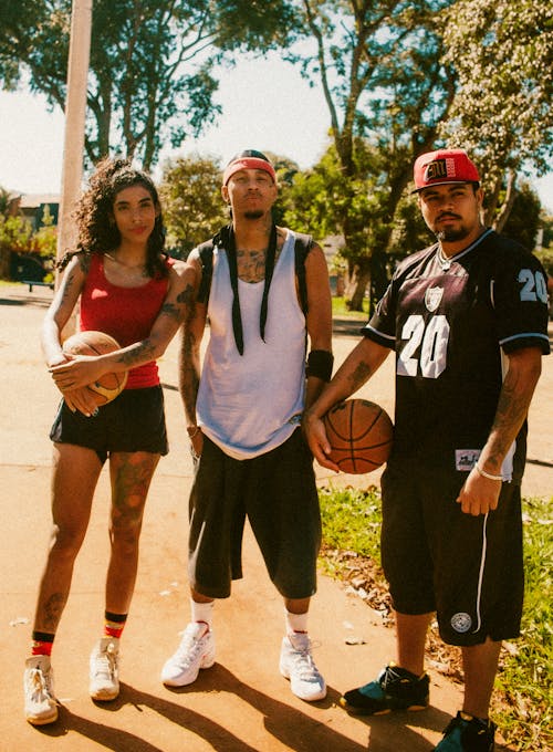 Group of Young People Holding Basketball Balls 