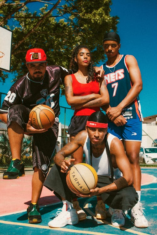 Group of Friends Posing in a Basketball Court