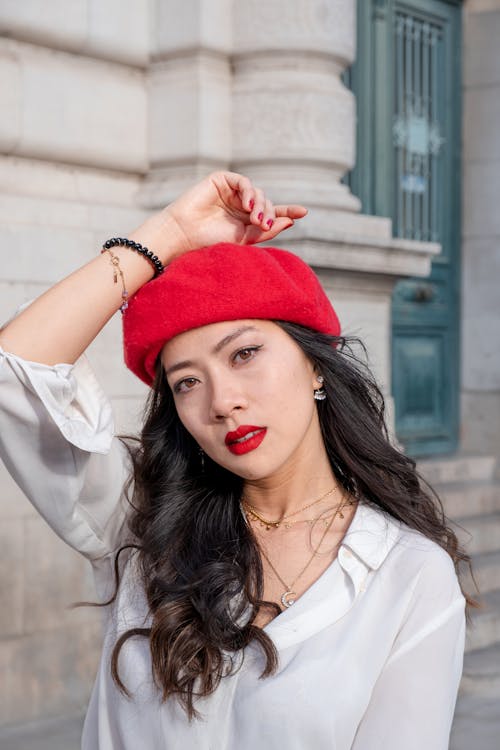 Young Brunette Wearing a Red Beret and Red Lipstick 