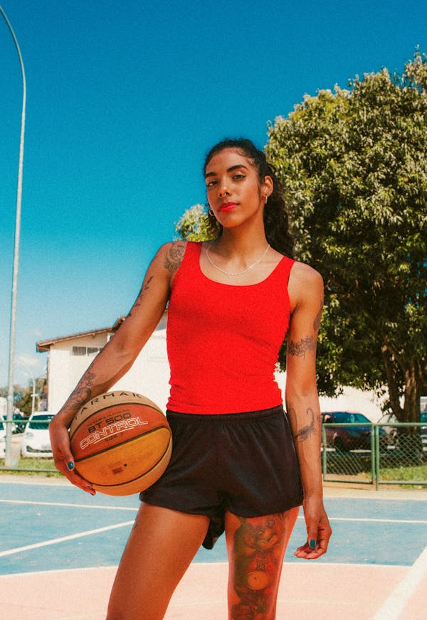 women-standing-with-the-ball-between-her-hands