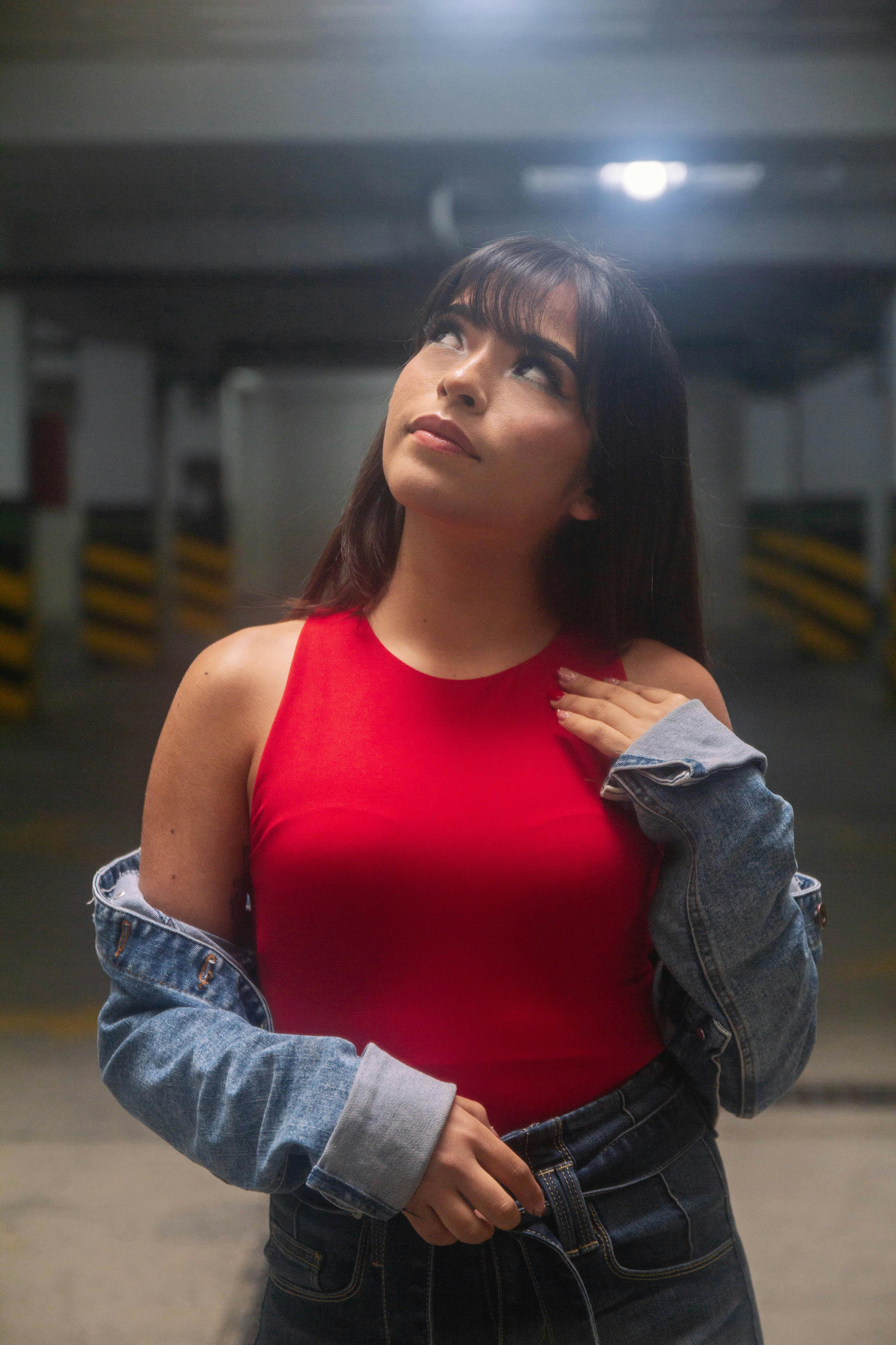 Woman in Purple Tank Top Standing in Empty Underground Parking Lot · Free  Stock Photo