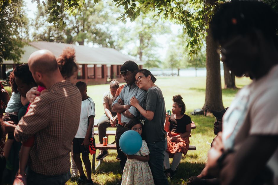 Family enjoying a picnic in a Westchester County park on a summer day