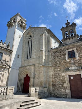 Historic facade of Igrexa de San Pedro in Lugo, a beautiful example of Spanish architectural heritage.