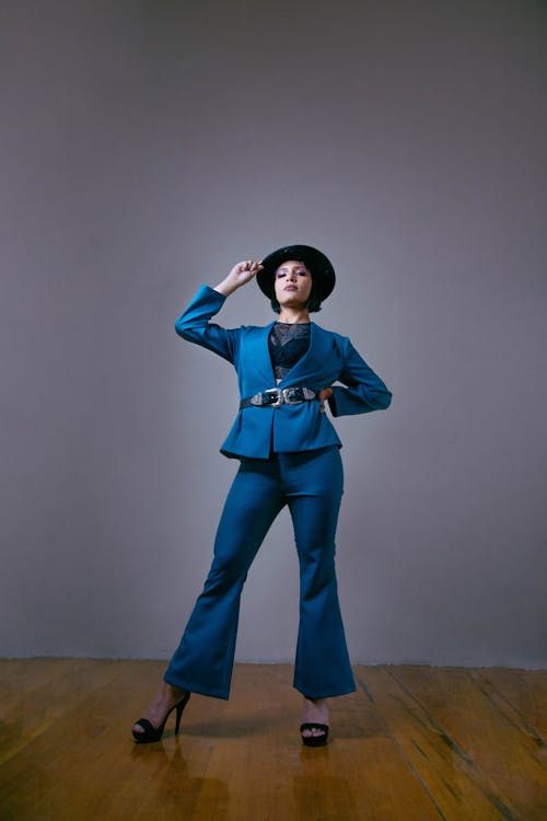 Young Woman Wearing an Elegant Suit and a Hat 