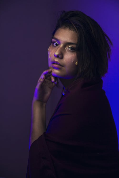 Woman with Black Hair Posing in Black Clothes