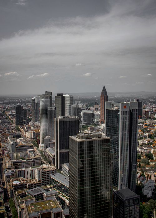 Free Aerial view of Frankfurt's modern skyline with skyscrapers under a cloudy sky. Stock Photo