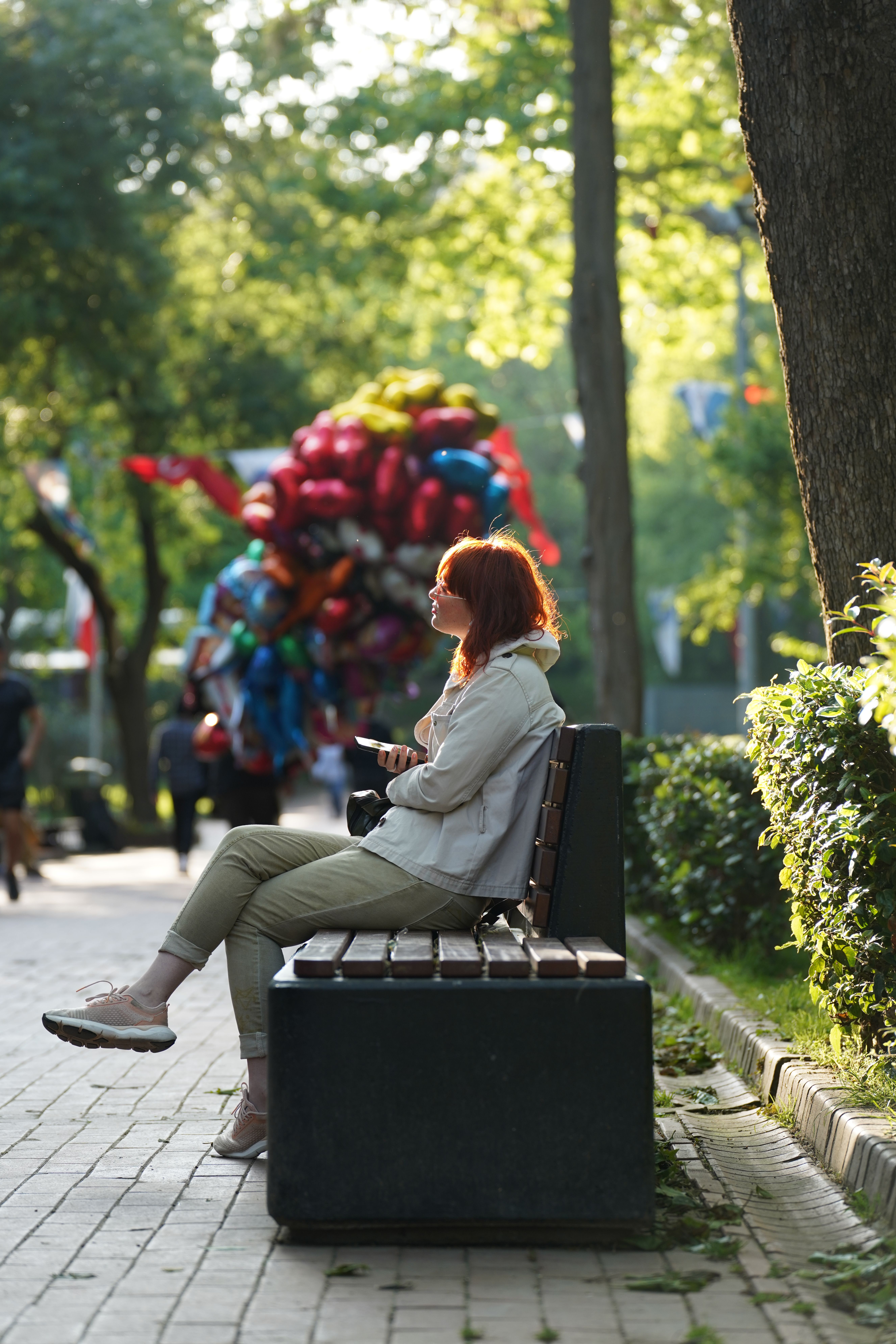 Woman Sitting on Bench at Park · Free Stock Photo