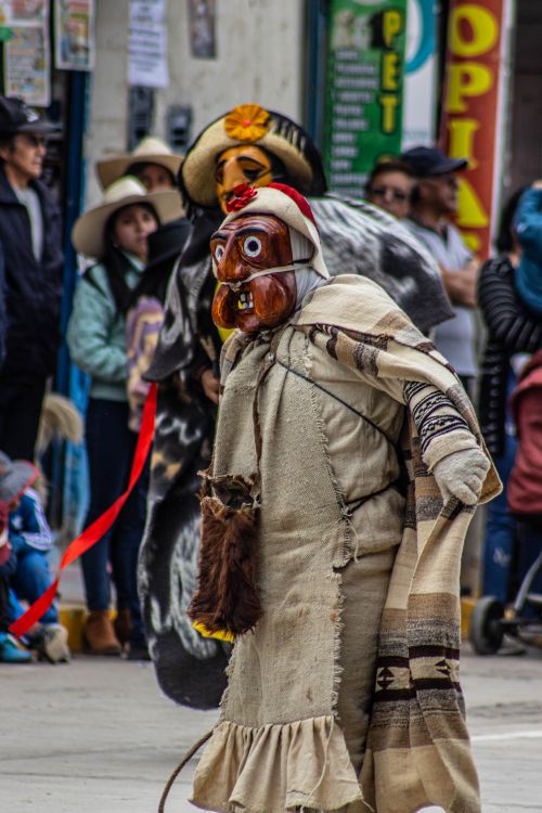 Free Colorful traditional costumes and masks at a lively festival in Mito, Peru. Stock Photo