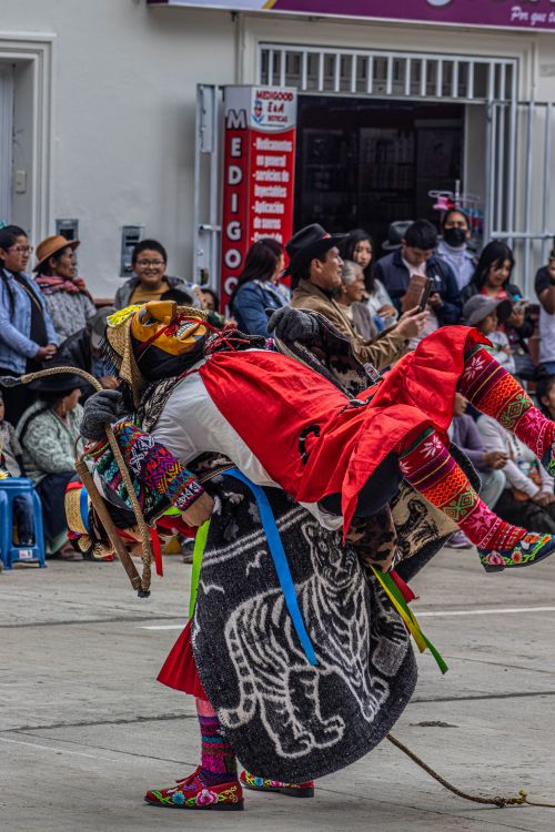 Free Vibrant cultural performance with dancers in traditional attire at a street festival in Mito, Perú. Stock Photo