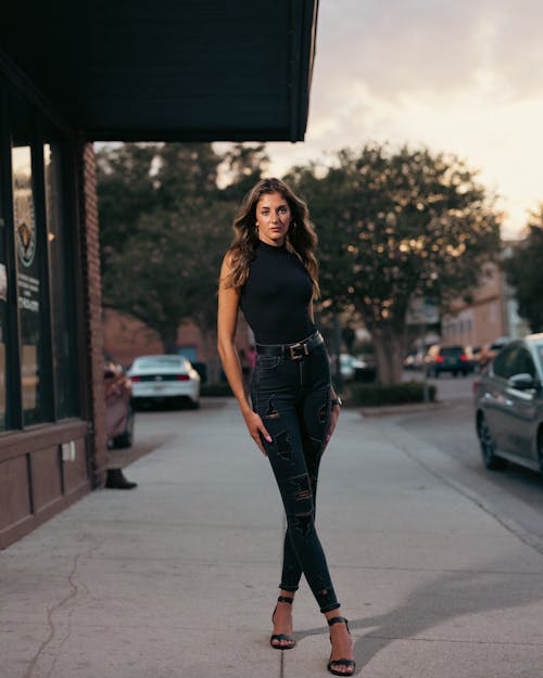 Model Standing on Sidewalk