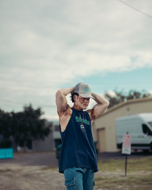 Man in Tank Top and in Cap