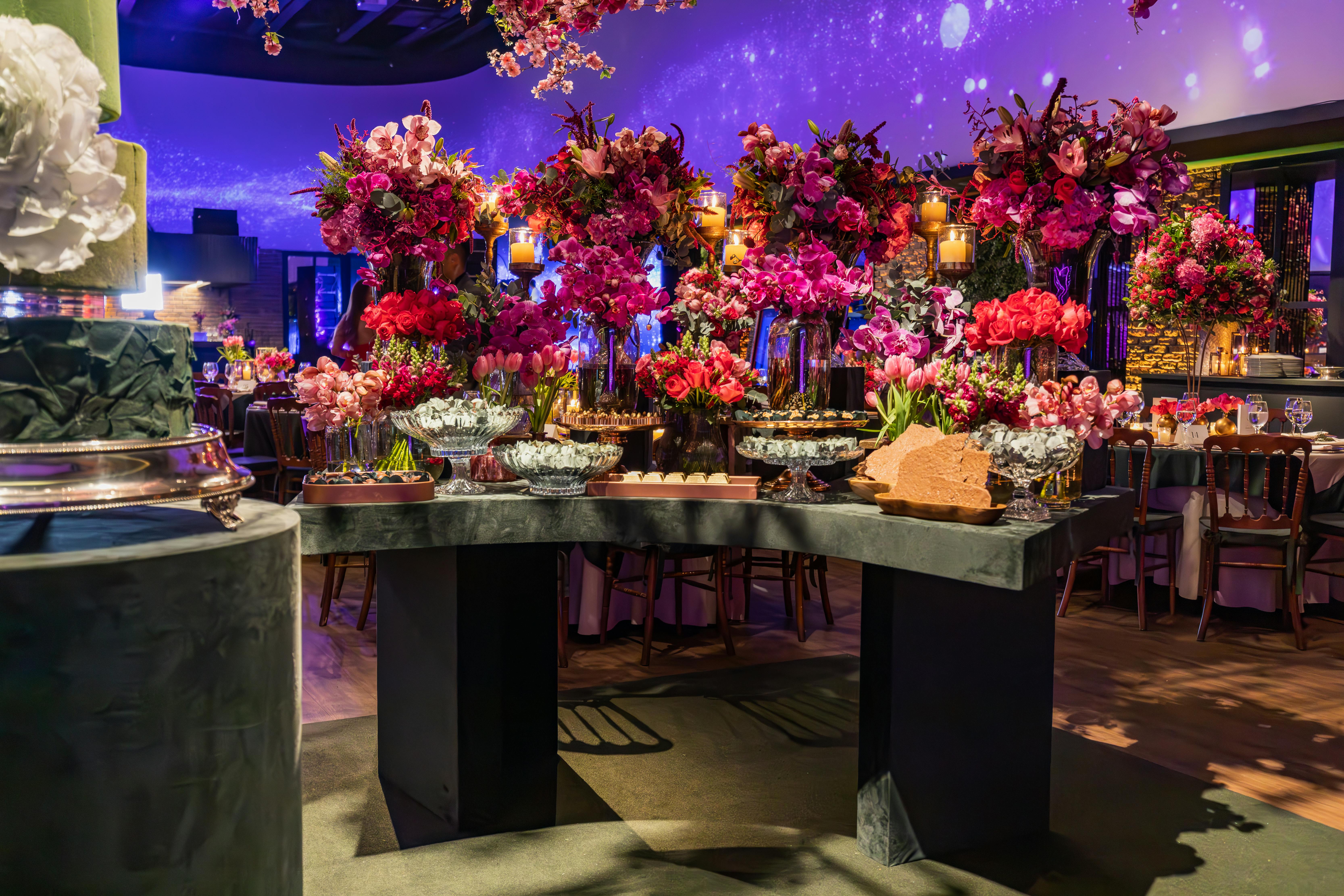 Elegant banquet setting with vibrant floral arrangements and luxurious décor.