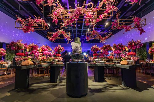 Free Lavish interior with vibrant floral decorations in a luxurious venue setup, perfect for celebrations. Stock Photo