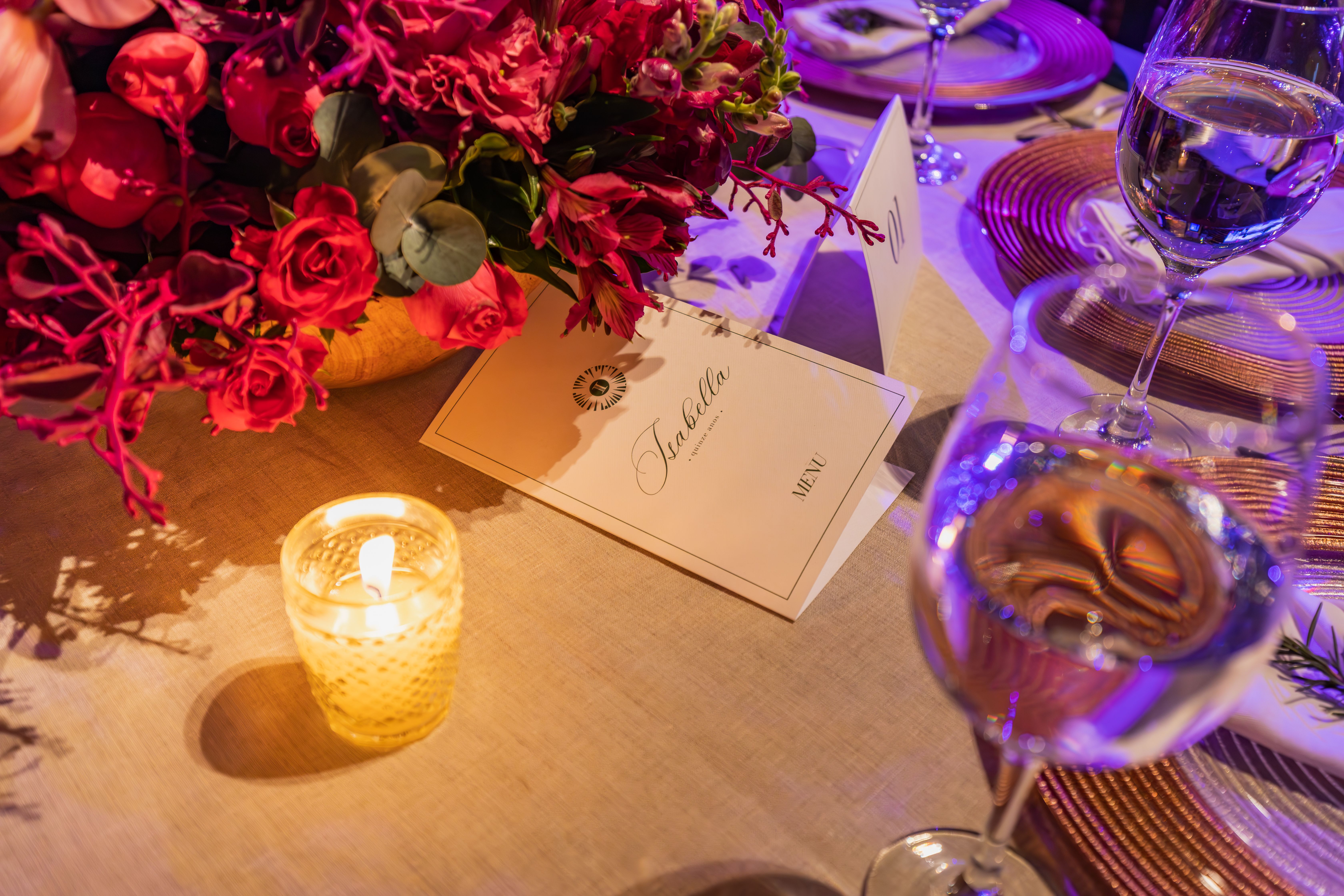A beautifully decorated dinner table with floral arrangements and candlelight, perfect for sophistic
