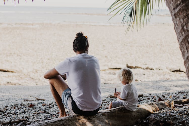 Man And Child On A Tropical Beach 