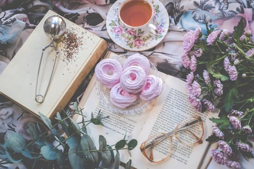 Floral Ceramic Cup and Saucer Above Open Book