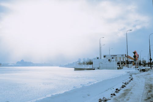 Frozen River and Snow near Oil Station