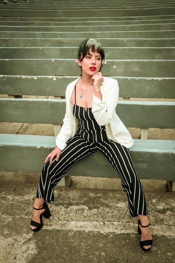 Portrait of a Female Model Posing in Striped Clothing · Free Stock Photo