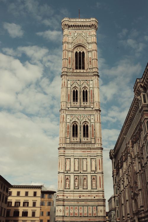 Free Giotto's Bell Tower in Florence, showcasing Gothic architecture against a blue sky. Stock Photo