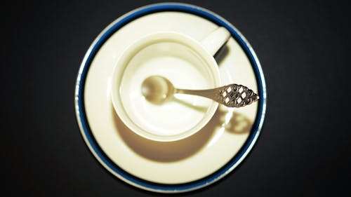 Silver-colored Spoon Inside White Teacup