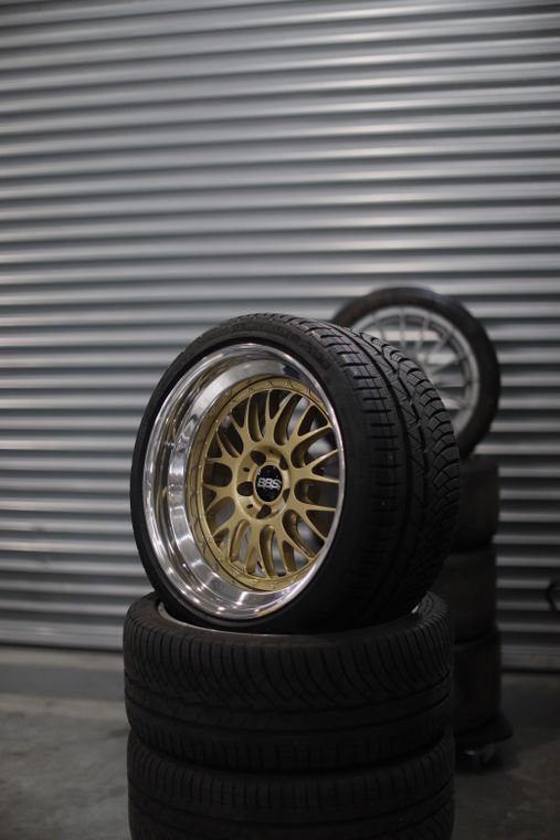 Stack of tyres with an alloy wheel