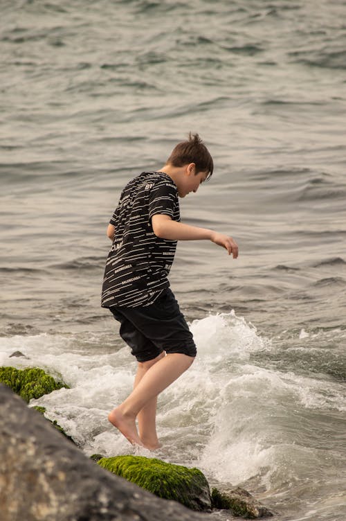 Man Standing on Sea Shore