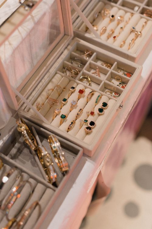 Free A close-up view of a jewelry box showcasing a variety of elegant rings and bangles in a sophisticated setting. Stock Photo