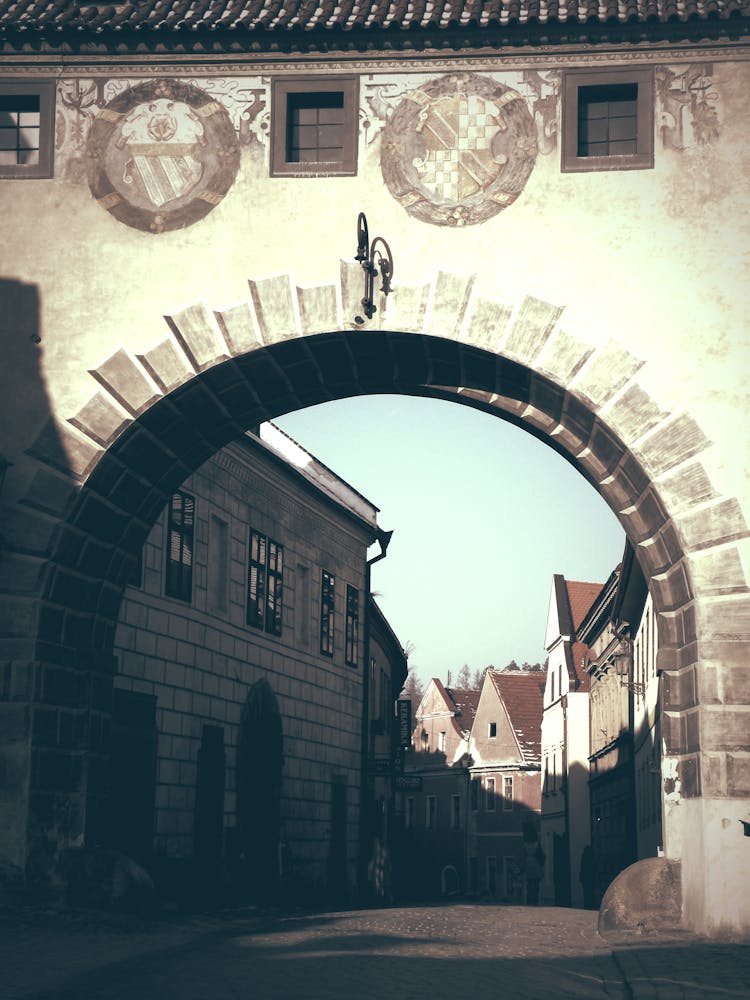 White Concrete Arch Alley During Daytime