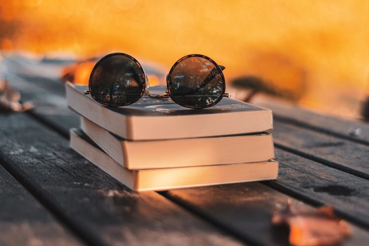 Sunglasses On Stack Of Books