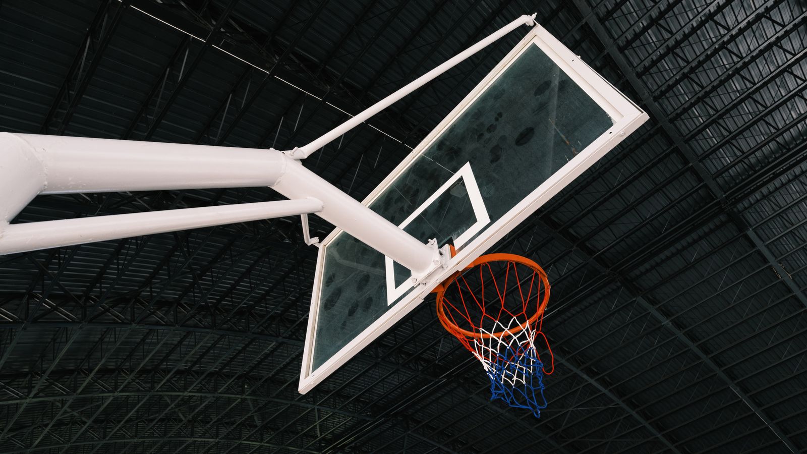 Representative licensed photograph of an indoor basketball hoop; not Jayson Tatum, the Celtics or the Nets game