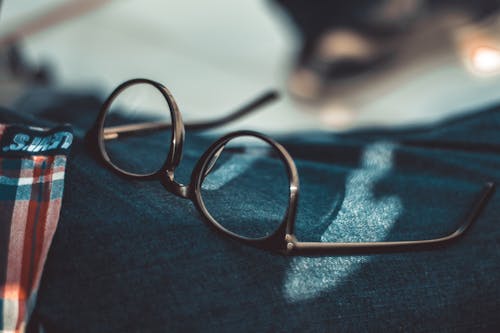 Black Framed Eyeglasses on Selective Focus Photo