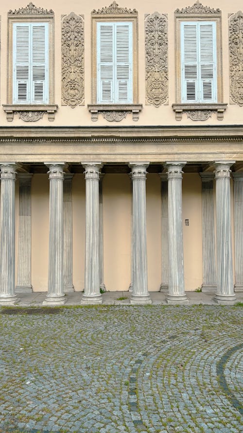 Facade of a Building with Columns and Carved Details 