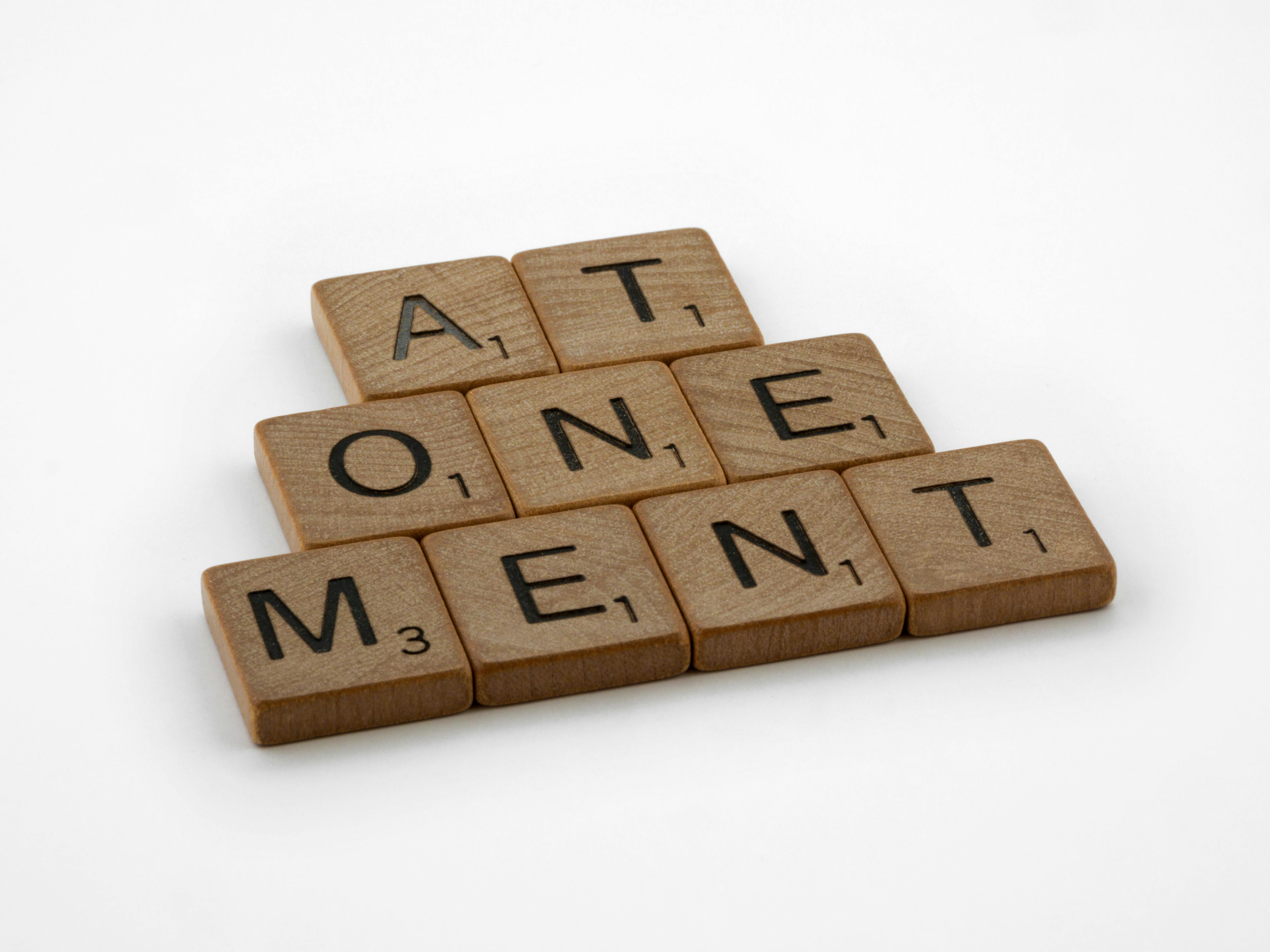 atonement sign out of scrabble tiles