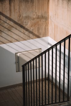 Artistic shadows and geometric patterns on a staircase in Valencia, Spain.