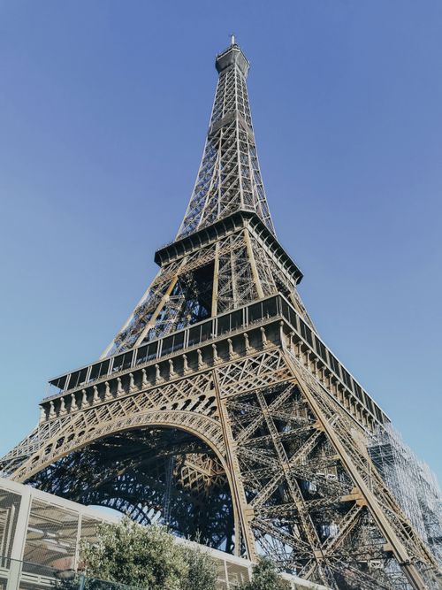 Free Stunning view of the Eiffel Tower in Paris with a clear blue sky. Stock Photo