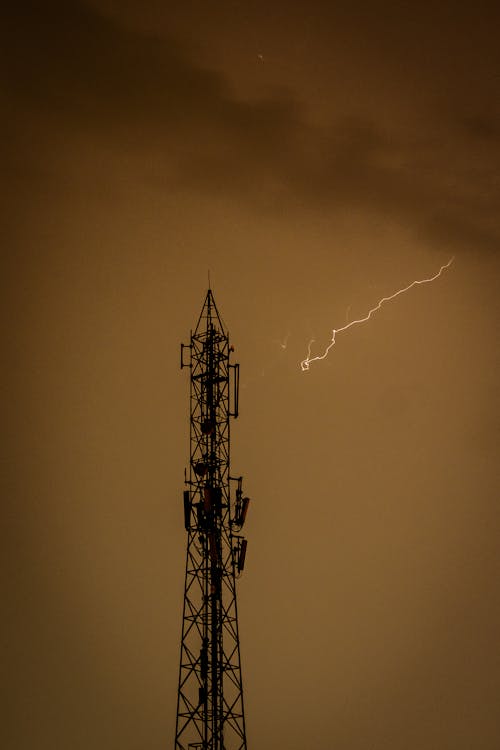 Lightning over Broadcast Tower at Sunset