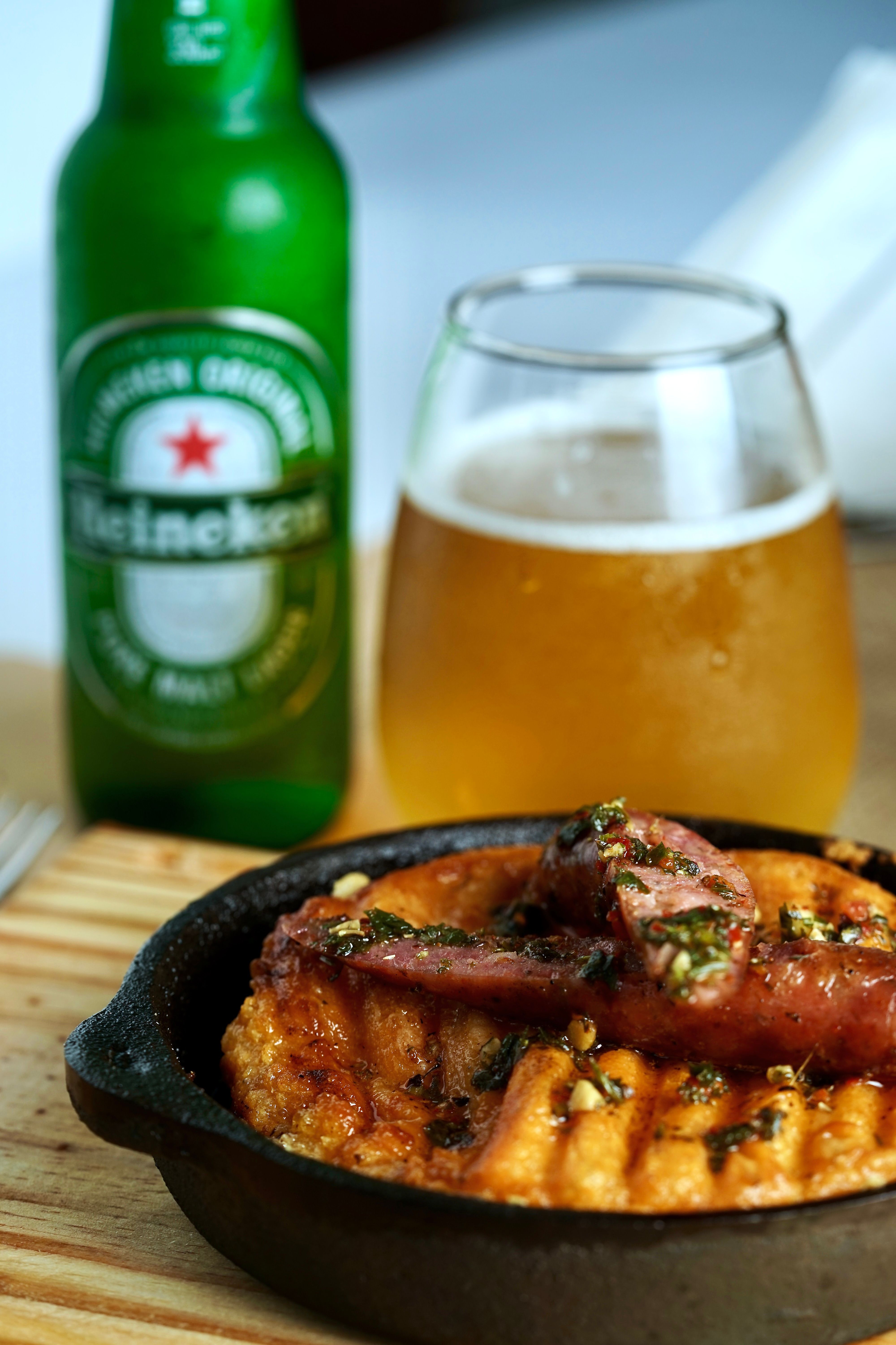Tasty grilled sausage with craft beer served in Buenos Aires capturing local flavor.