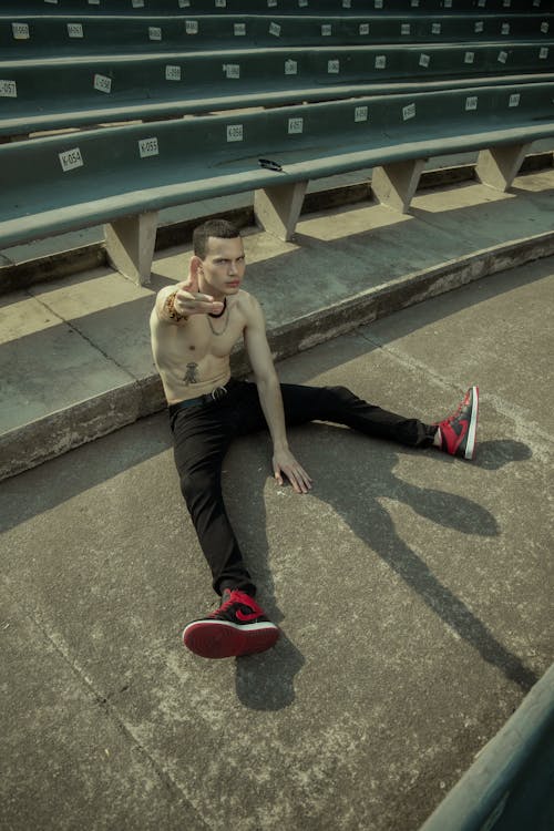 Man Sitting and Posing Topless